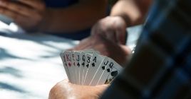 Poker hand with aces, jacks, kings and queens